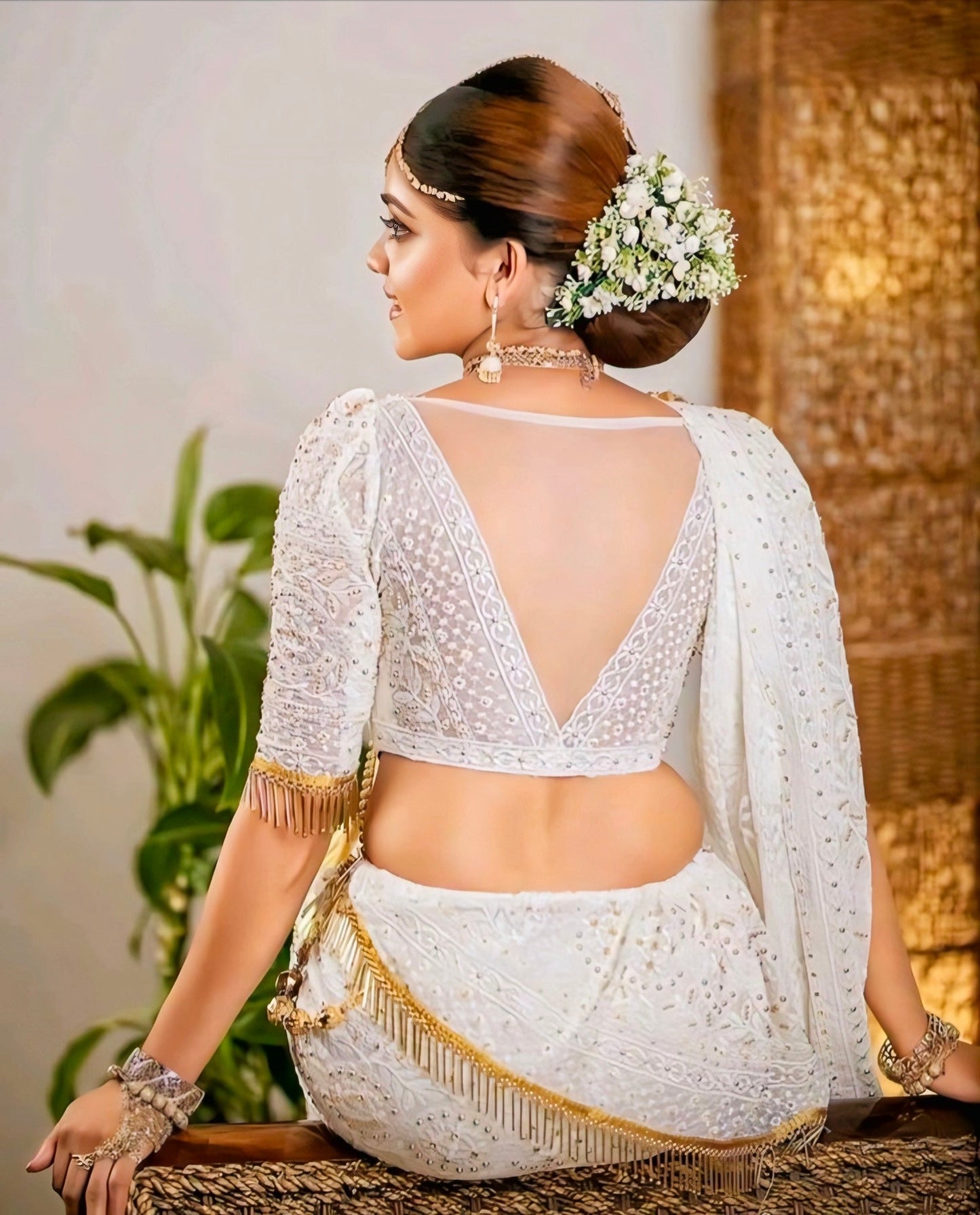 White embroidered bridal blouse with deep V-back design and sequin detailing