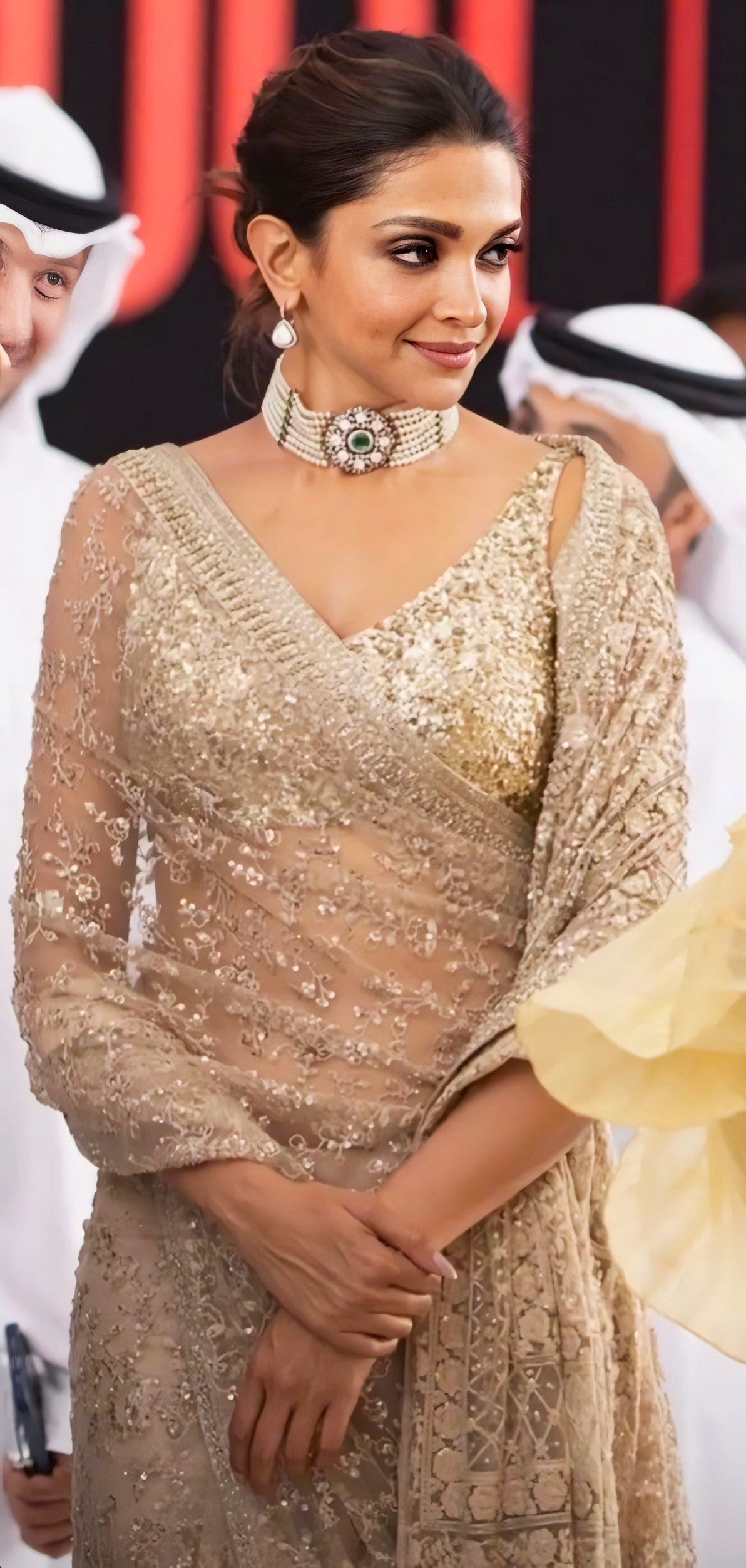 Golden net embellished Deepika Padukone–style saree with sequin embroidery