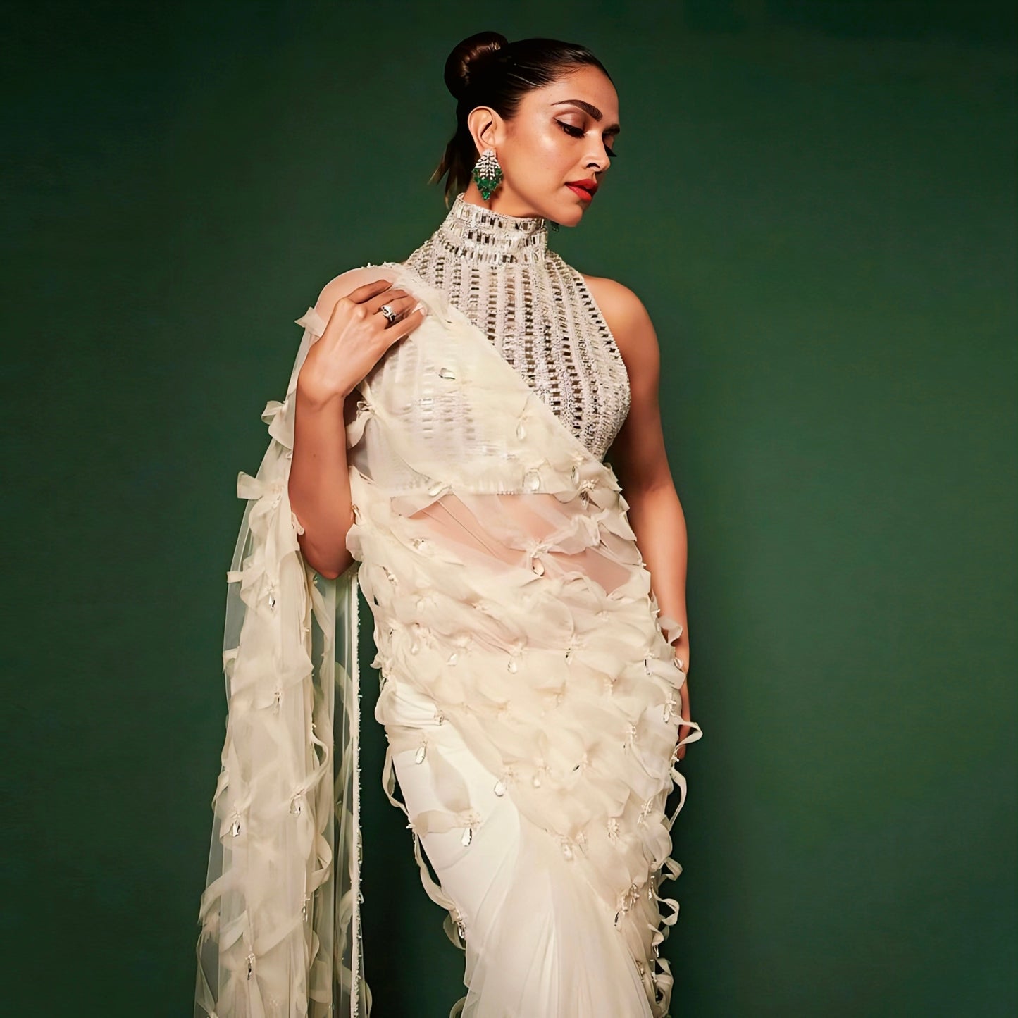 Ivory ruffle designer saree with embellished high neck blouse inspired by celebrity styling