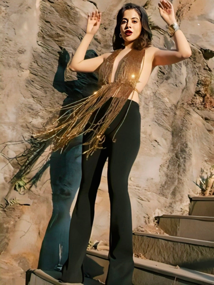 Urfi Javed gold beaded fringe top with plunging deep V-neck paired with black high-waisted pants couture fashion look