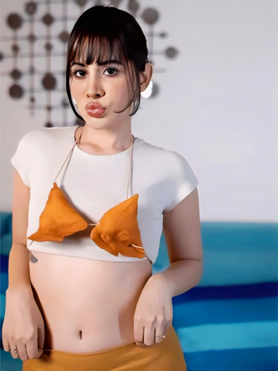 Urfi Javed samosa bralette outfit with white crop top and mustard yellow skirt bold edible fashion look