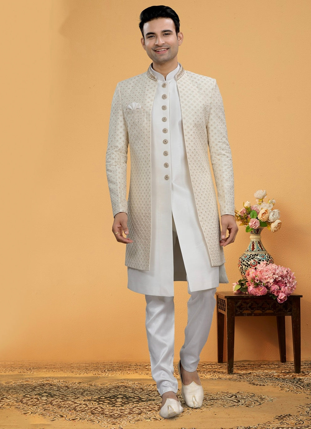 Engagement white dress for men featuring embroidered ivory sherwani with kurta churidar