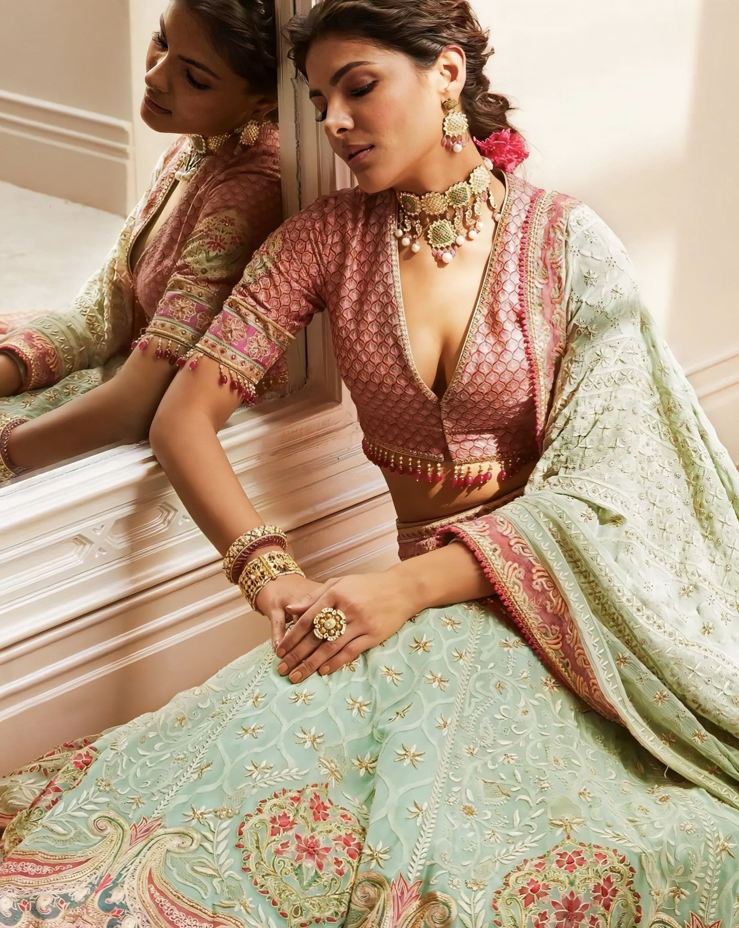 Rose pink deep V-neck designer blouse with tassel detailing for lehenga