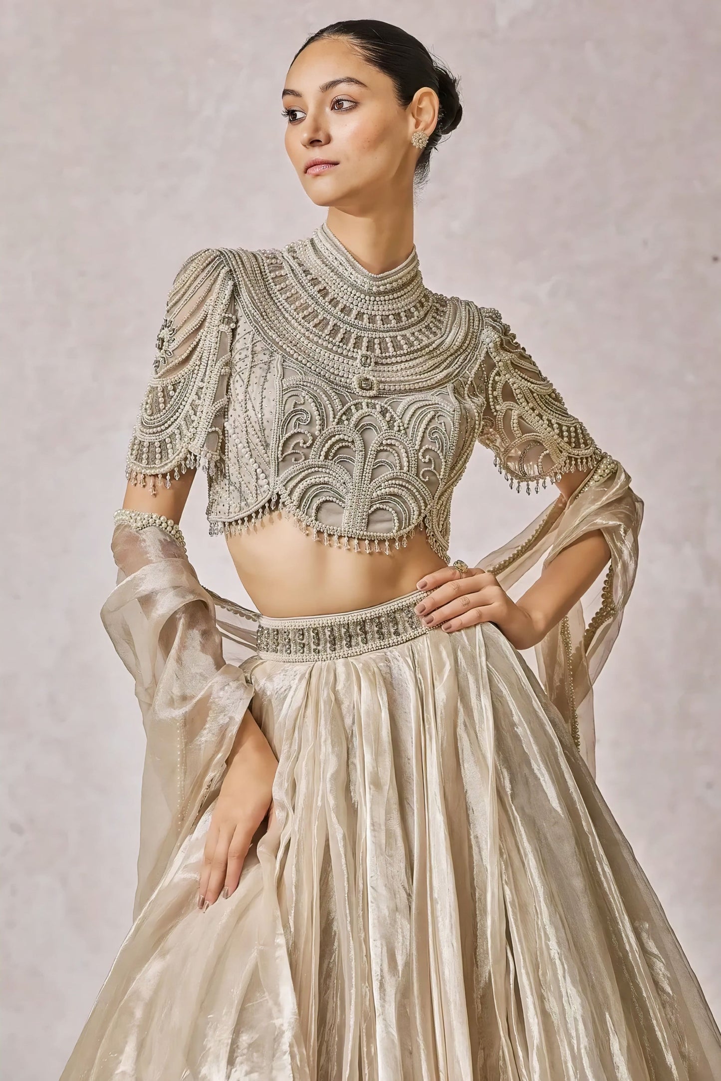Ivory high neck embroidered blouse with pearl detailing and elbow length sleeves for bridal wear