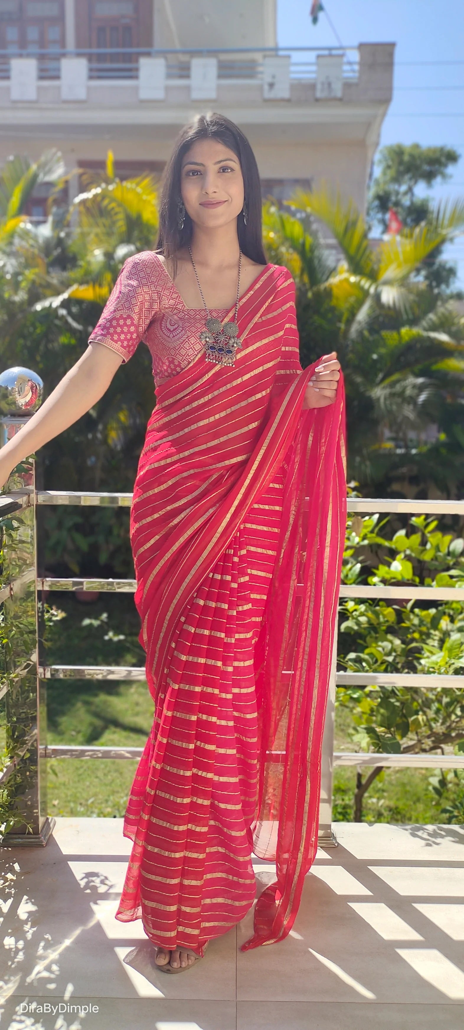 Radiant Orange-Red Georgette Saree with Silver Zari Work