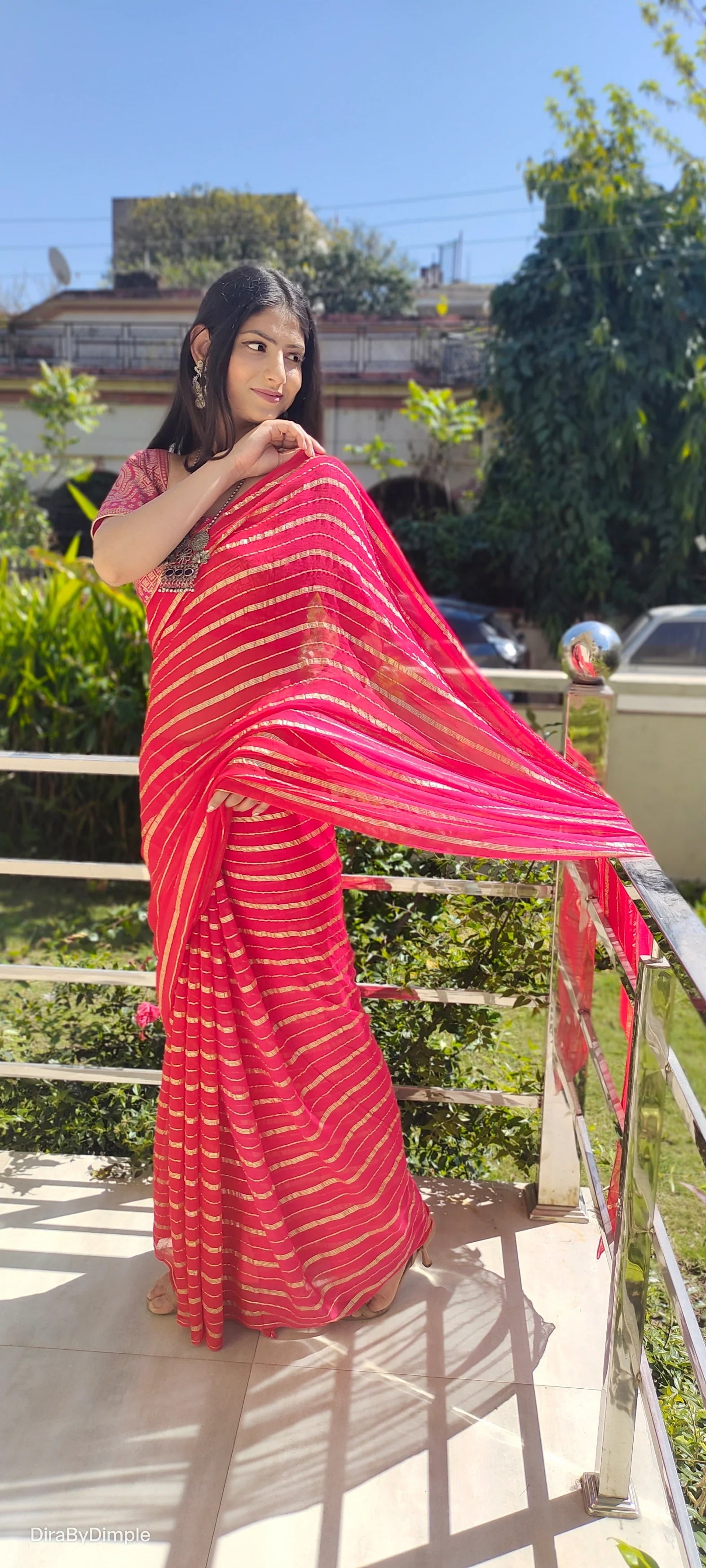 Radiant Orange-Red Georgette Saree with Silver Zari Work