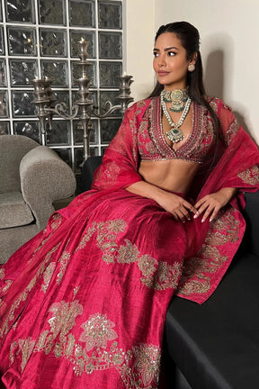 Esha Gupta in Cherry Red Reanna Lehenga