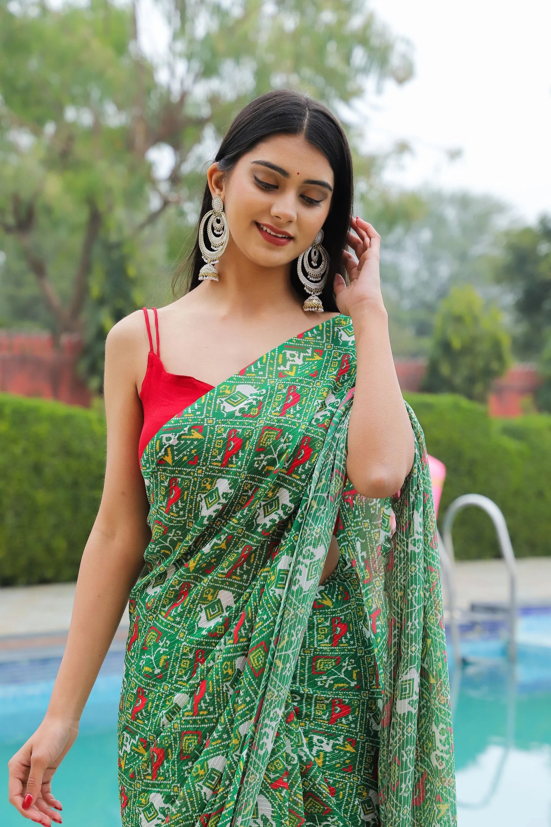 Festive Patola Printed Georgette Saree with Sequins and Thread Work