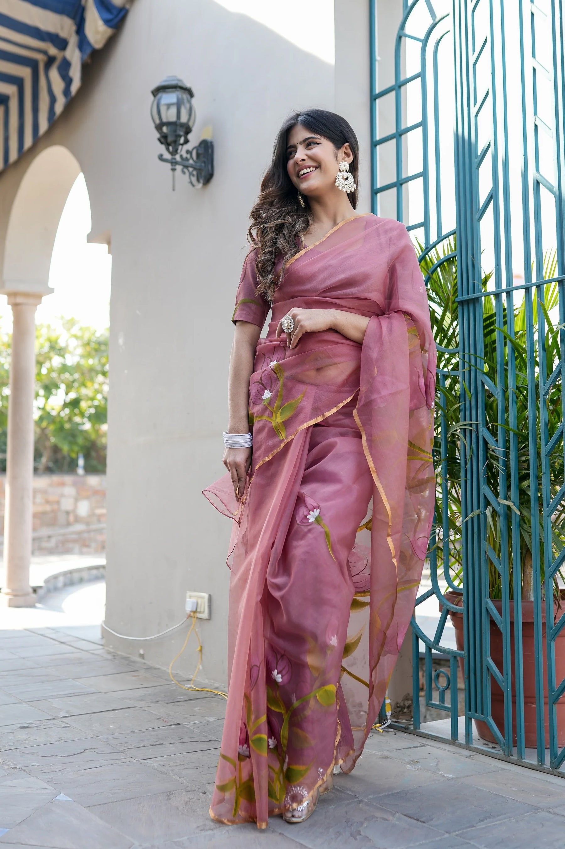 Handpainted Organza Saree with Floral Designs & Golden Zari Border