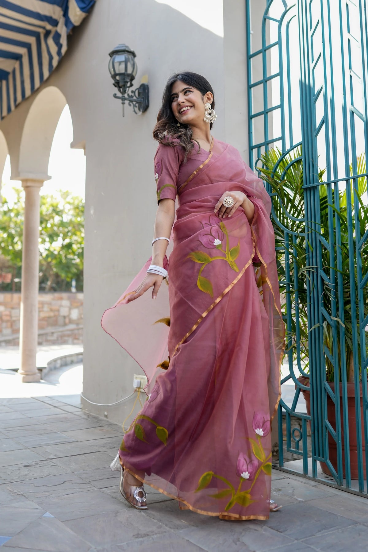 Handpainted Organza Saree with Floral Designs & Golden Zari Border