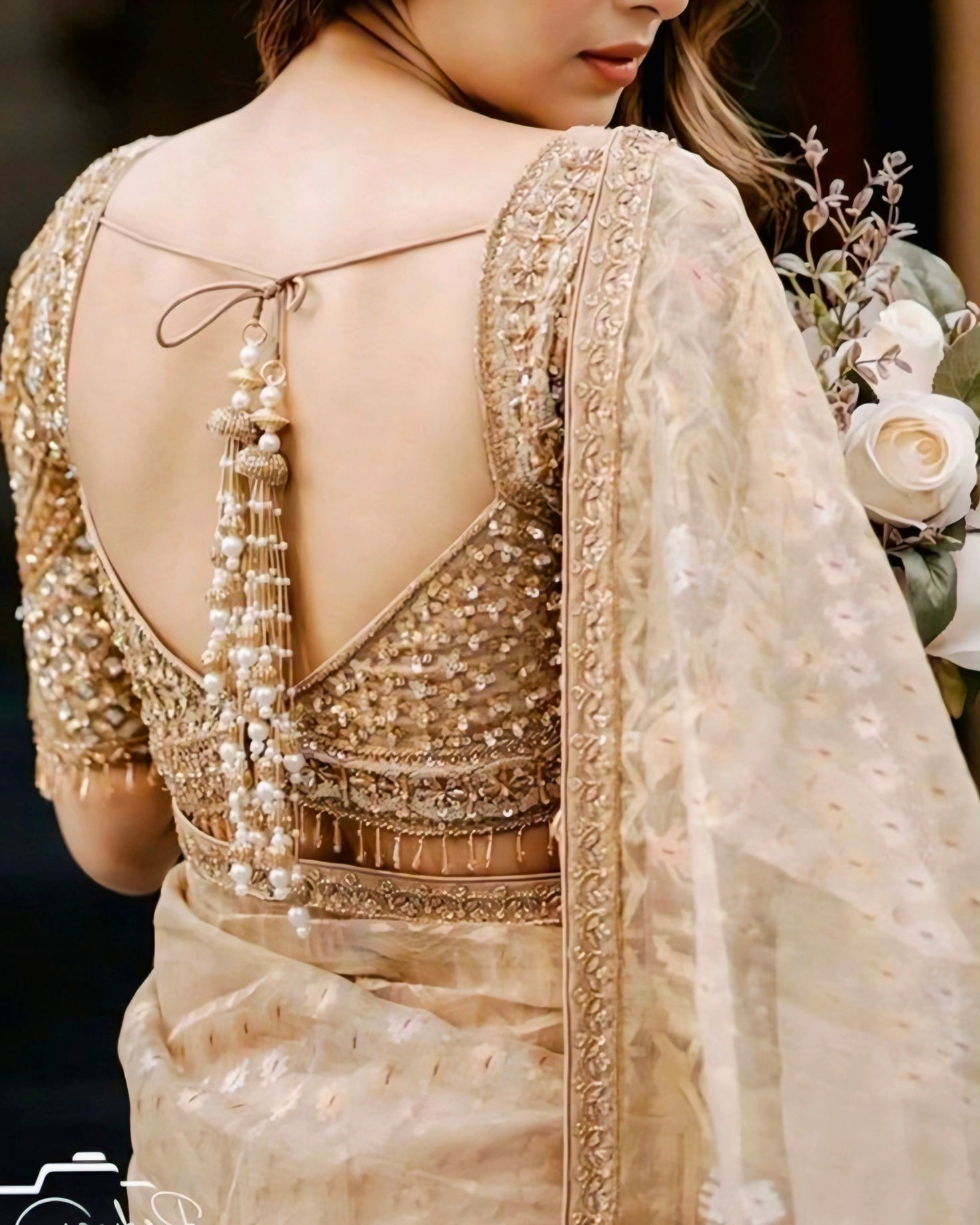 Golden sequin bridal blouse with deep back and pearl tassel dori — designer wedding blouse for saree look 2025.