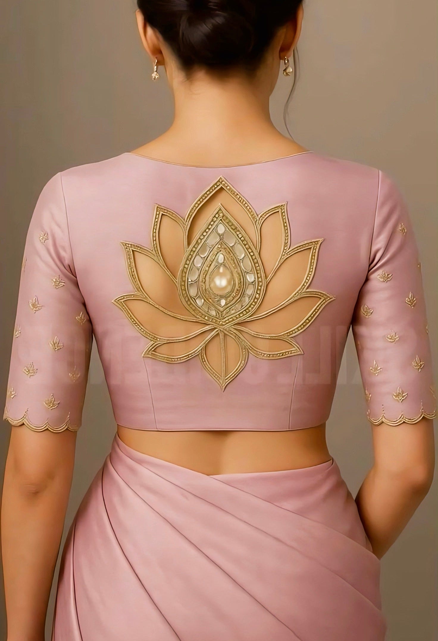 Pink blouse with lotus cutwork embroidery and pearl detail on back — perfect for elegant wedding or festive saree look.