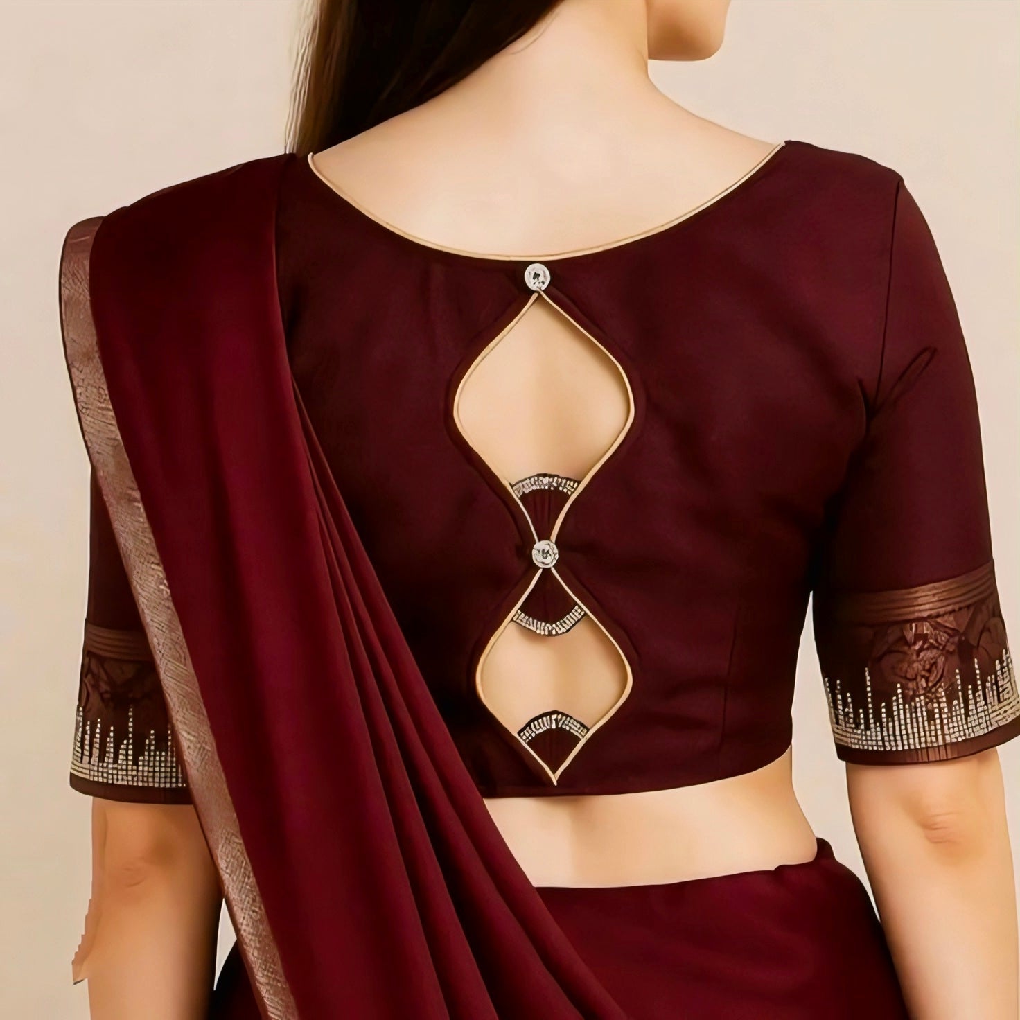 Maroon silk designer blouse with diamond cutout back and stone detailing for saree.