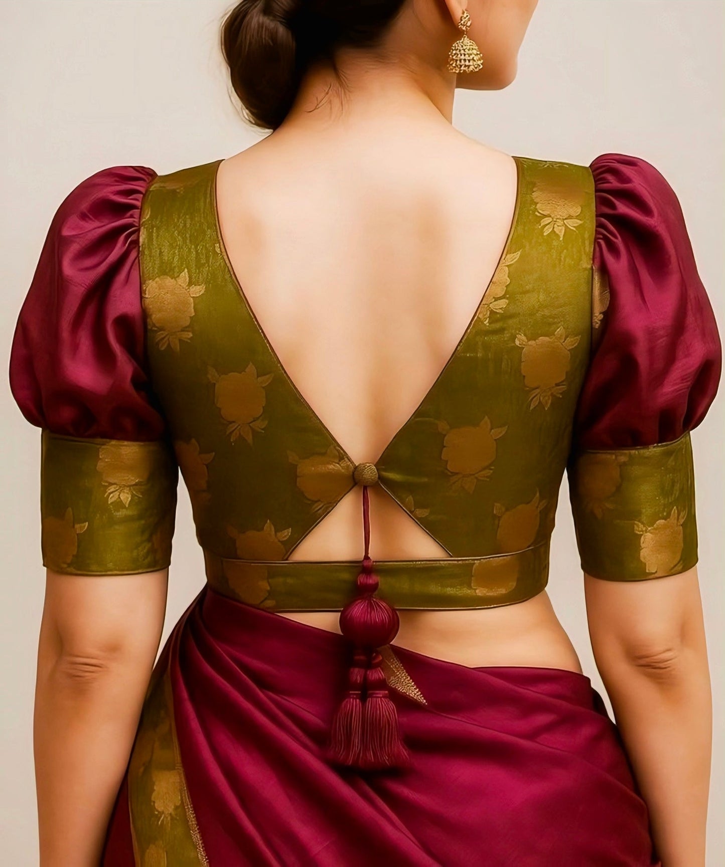 Maroon and olive green silk blouse with deep V-back design, puff sleeves, and tassel tie.