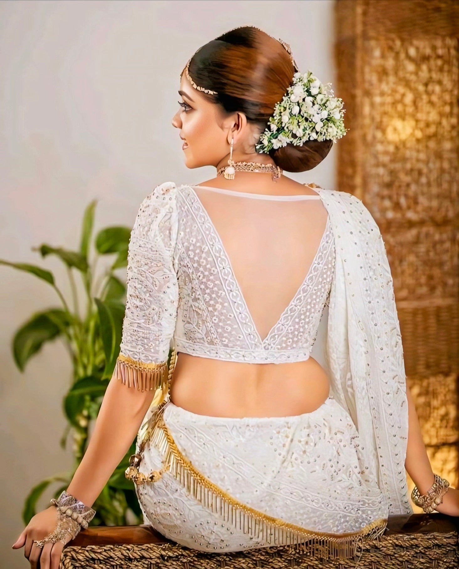 White embroidered bridal blouse with deep V-back design and sequin detailing