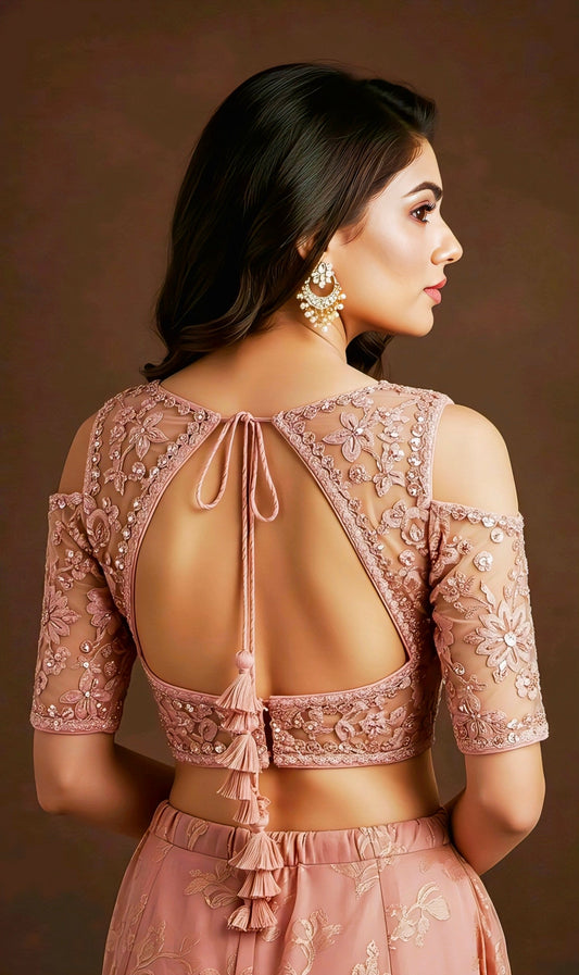 Peach embroidered blouse with floral net sleeves and stylish cut-out back design featuring long tassel dori