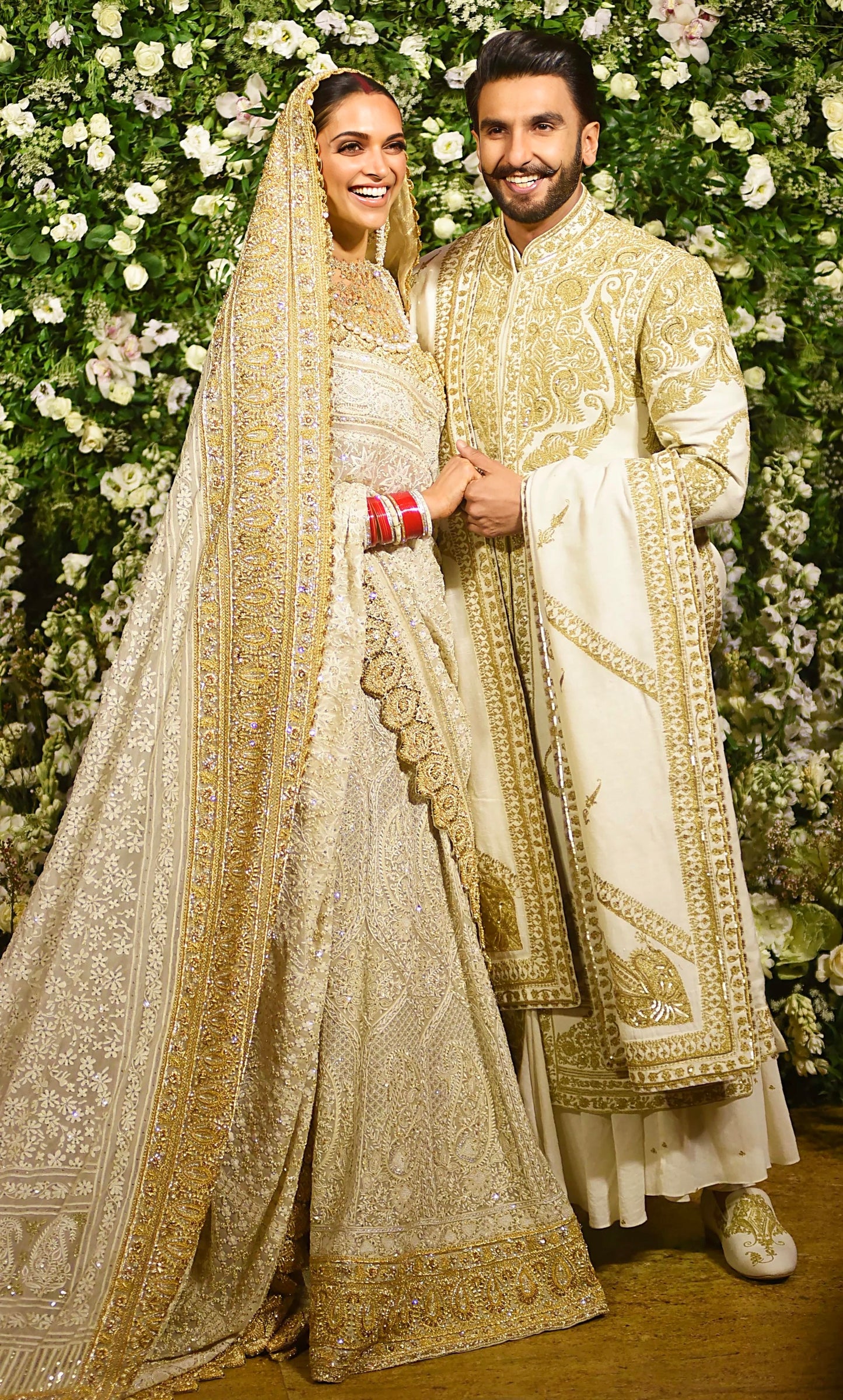 Ivory bridal lehenga with golden embroidery and matching heavy dupatta