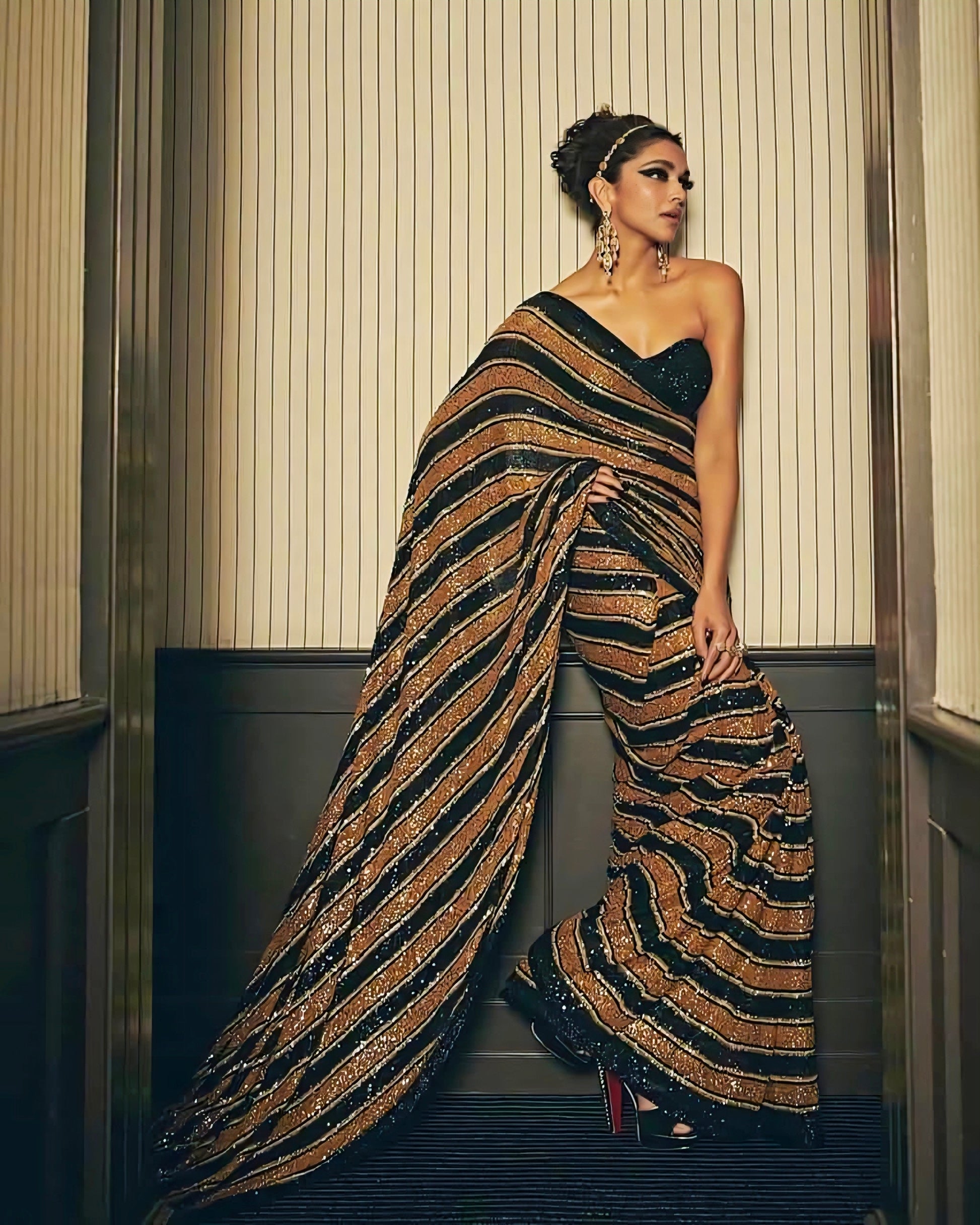 Deepika Padukone inspired black and gold sequin striped saree with strapless blouse