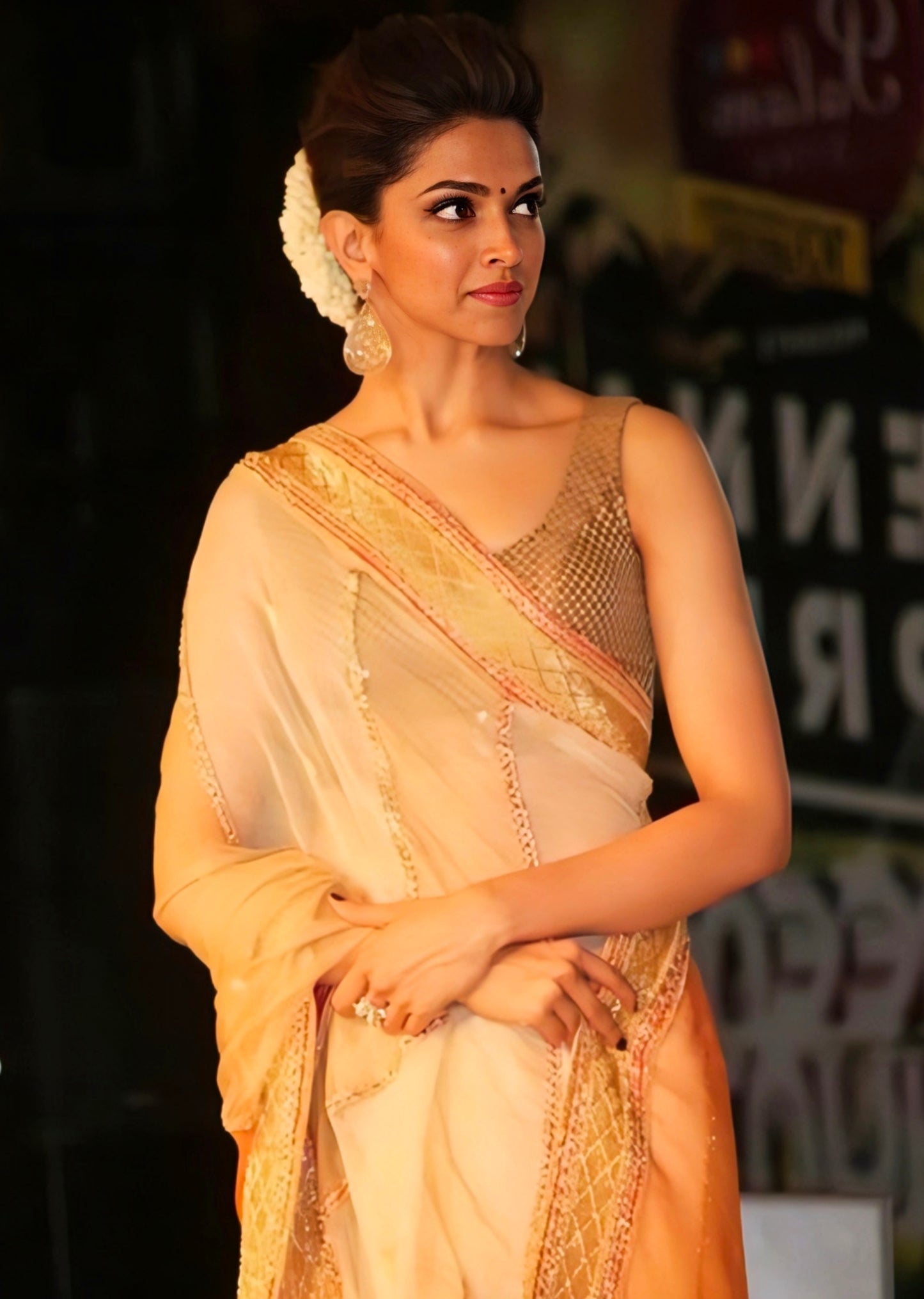 Deepika Padukone inspired peach and gold net saree with designer blouse