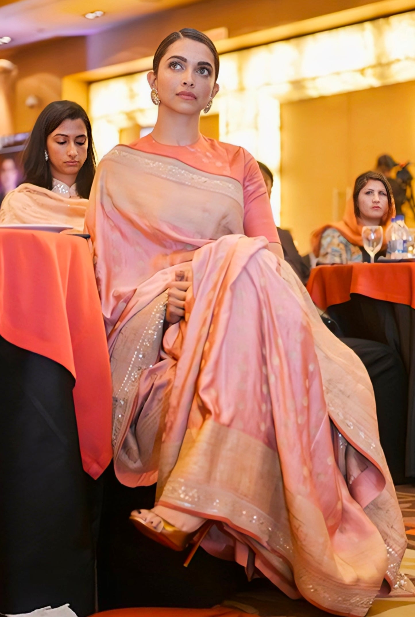 Pastel pink silk saree with subtle shimmer border in elegant drape