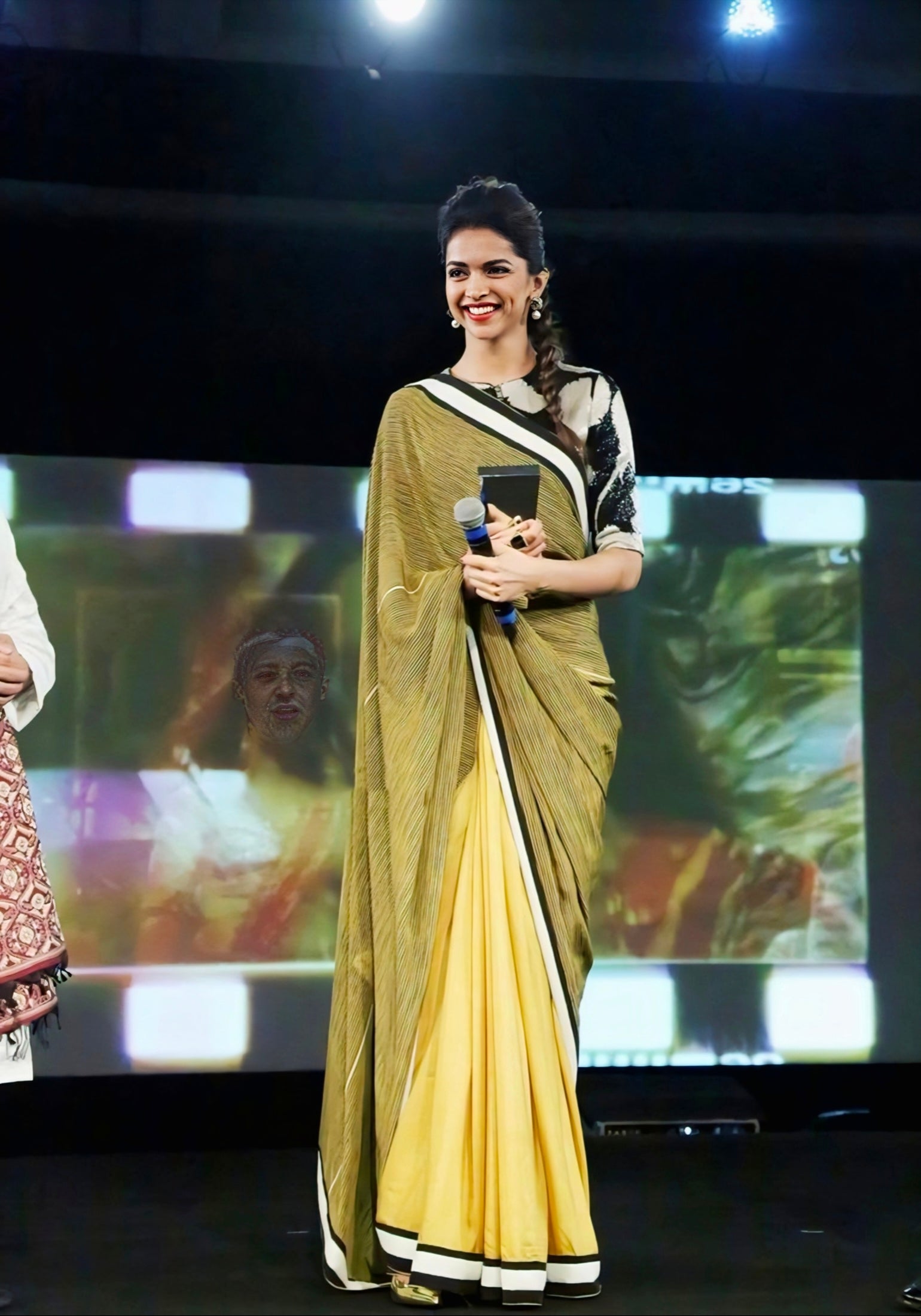 Yellow and olive dual-tone saree with sequin embroidered blouse worn in elegant modern style