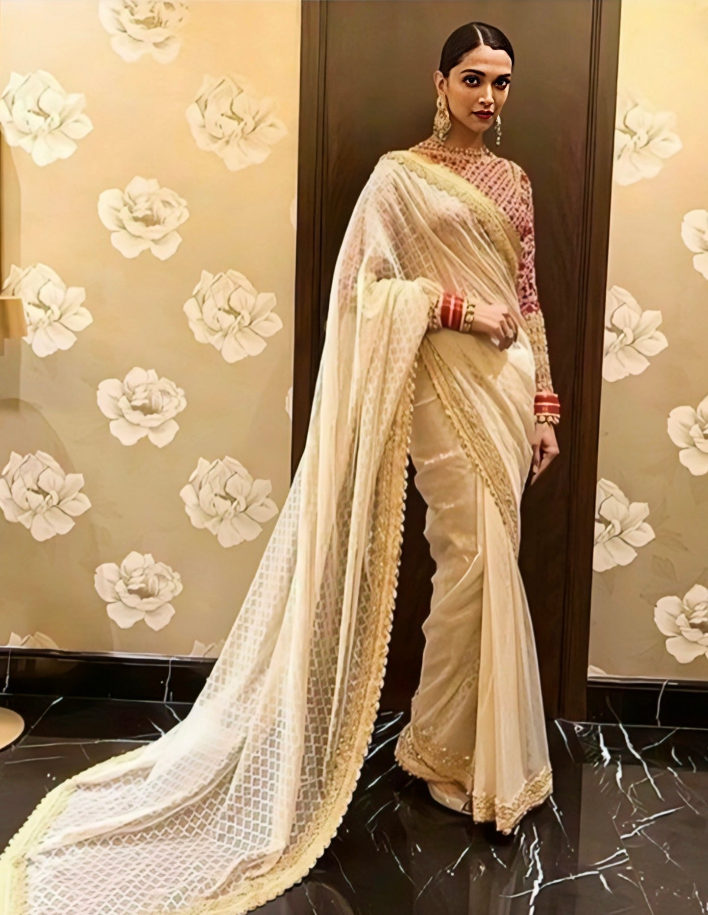 Ivory net border celebrity inspired saree with embellished blouse