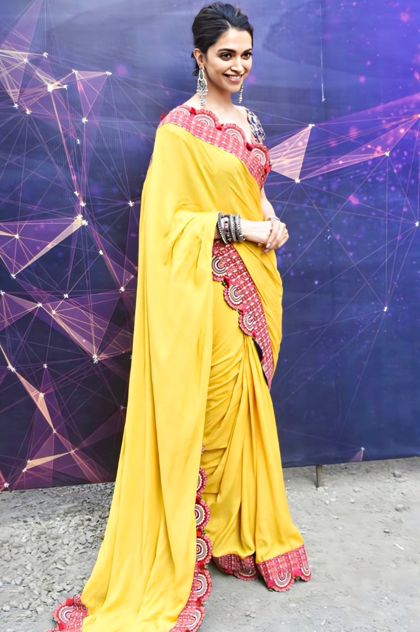 Mustard yellow saree with red embroidered scalloped border