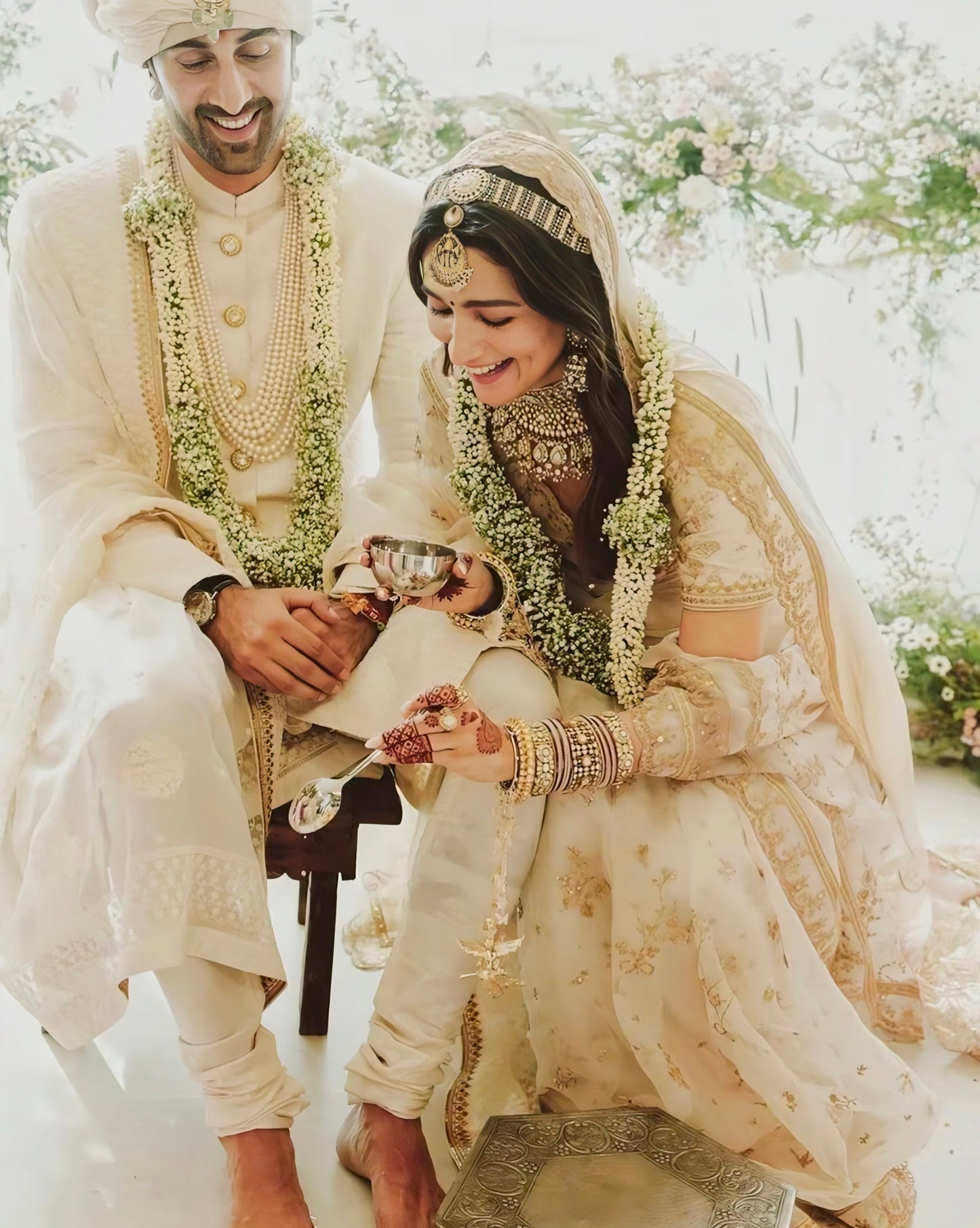 Ivory and gold Alia Bhatt wedding lehenga inspired bridal outfit with minimal embroidery and soft dupatta.