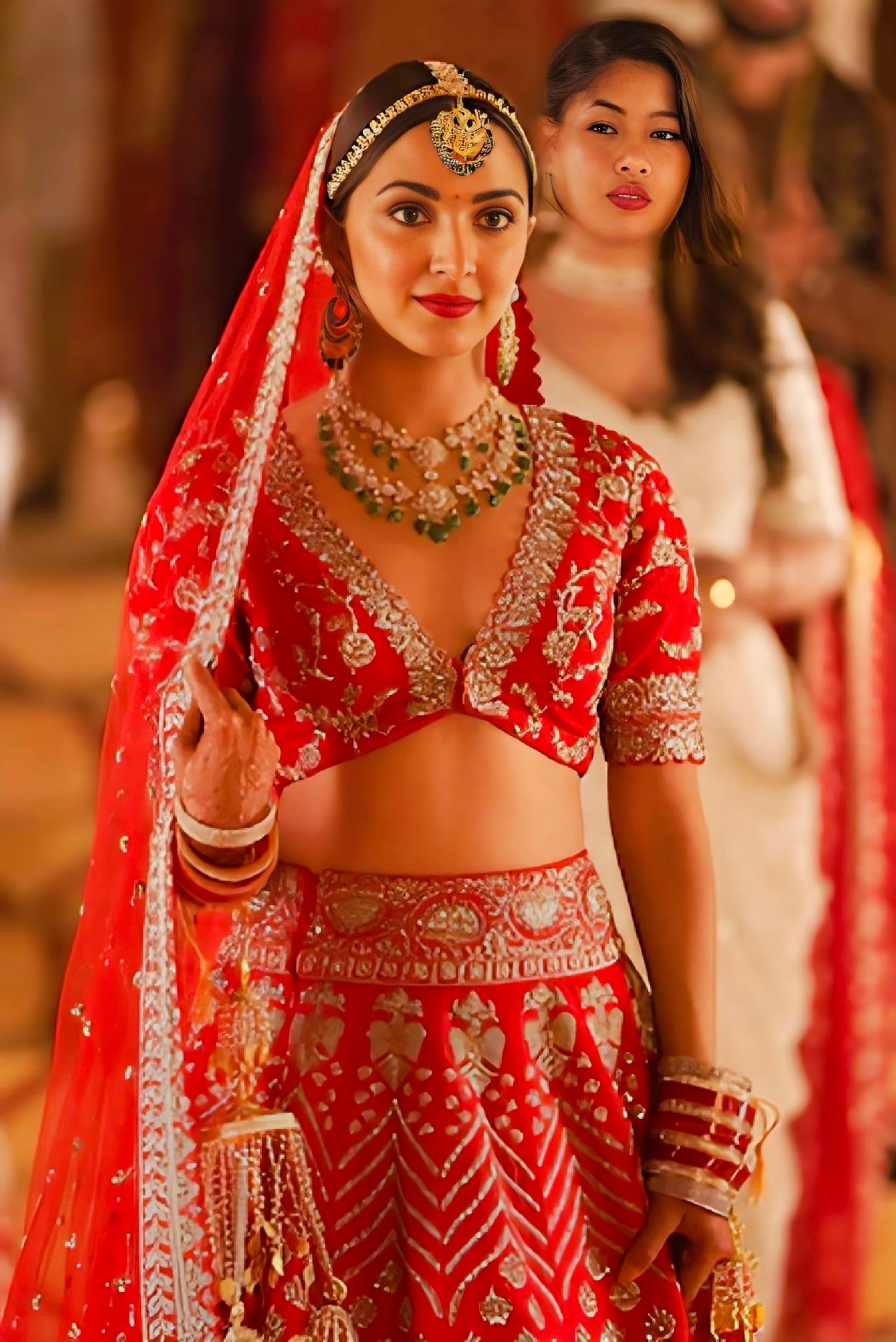 Red heavy embroidered bridal lehenga with zari work, sequins and dupatta — Bollywood style traditional Indian wedding outfit.
