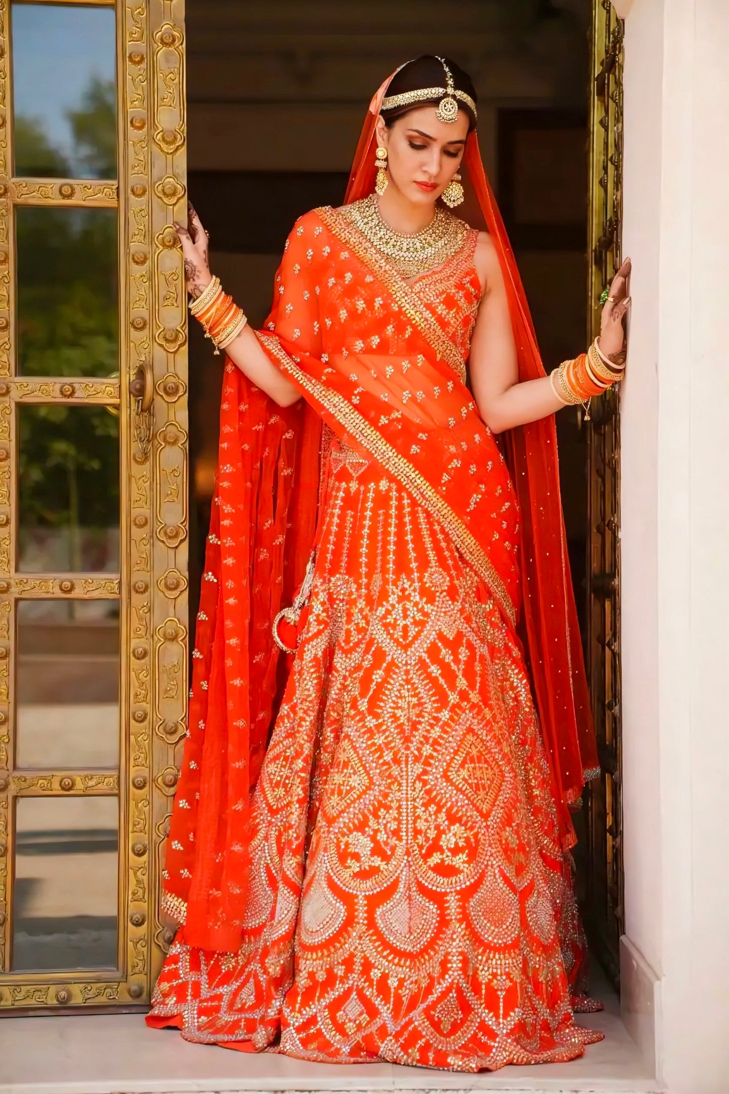 Kriti Sanon inspired orange bridal lehenga with heavy embroidery and dupatta – Rimzim Fashion.