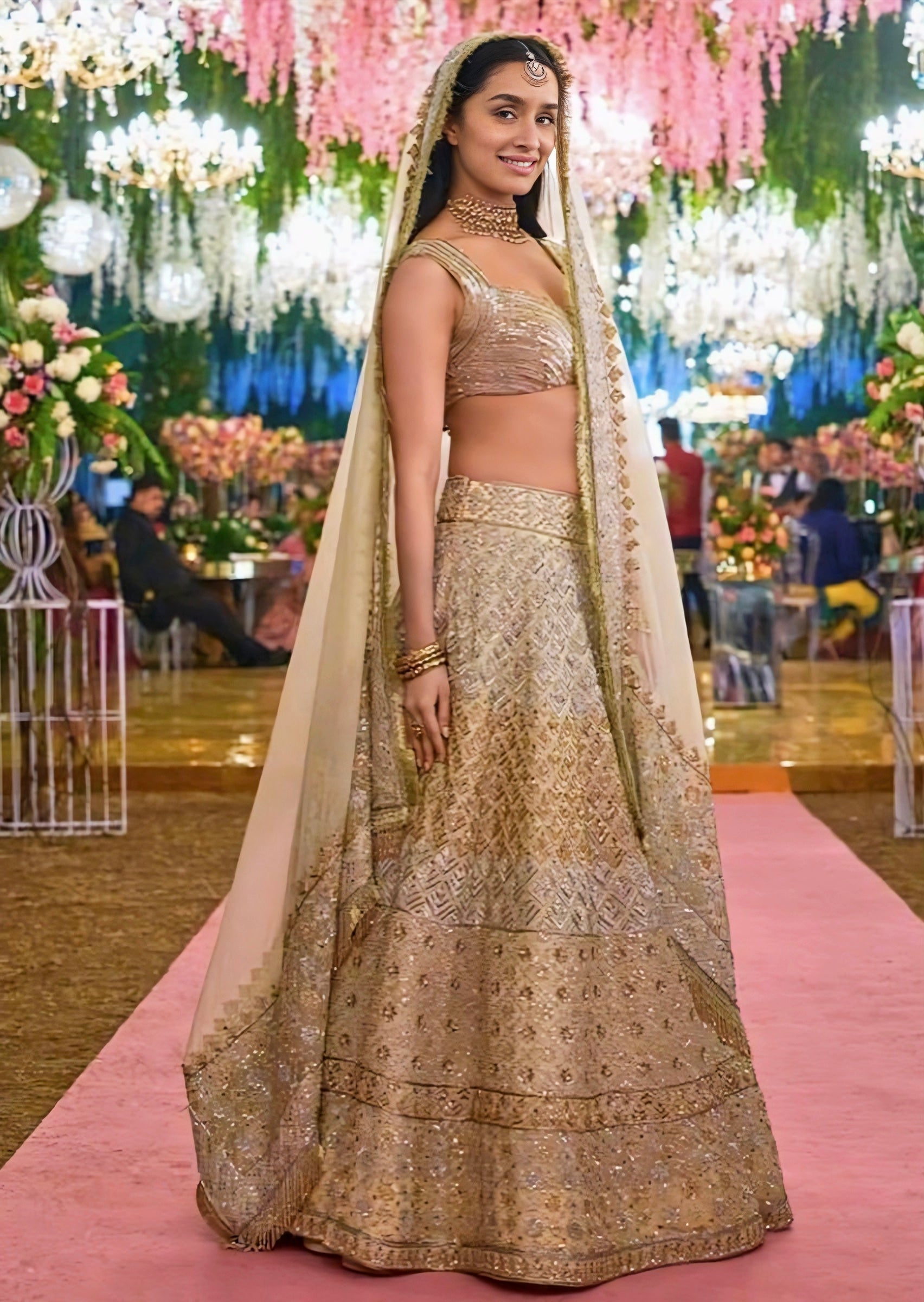 Shraddha Kapoor inspired gold beige wedding lehenga with sleeveless blouse and net dupatta