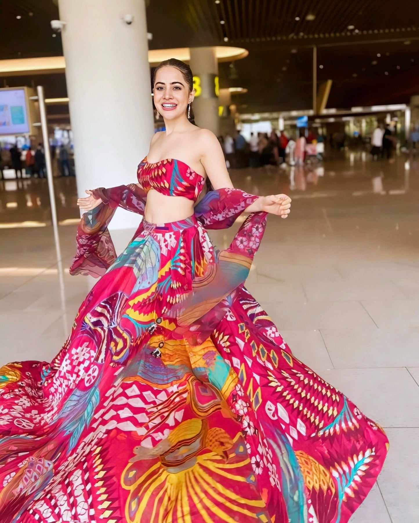 Nora Fatehi inspired multicolor printed lehenga choli with strapless blouse