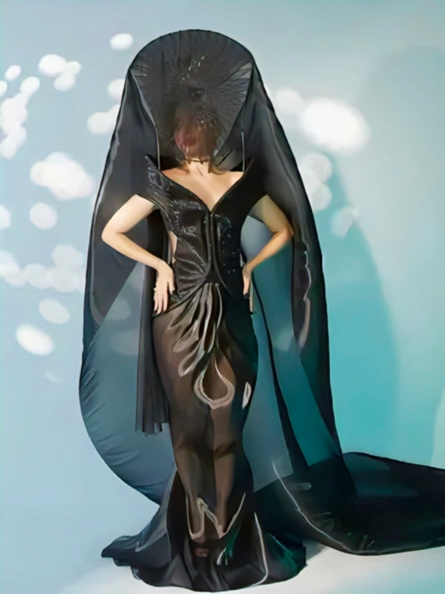 Urfi Javed black sheer couture gown with structured elements inspired by mythology time philosophy and cosmic universe