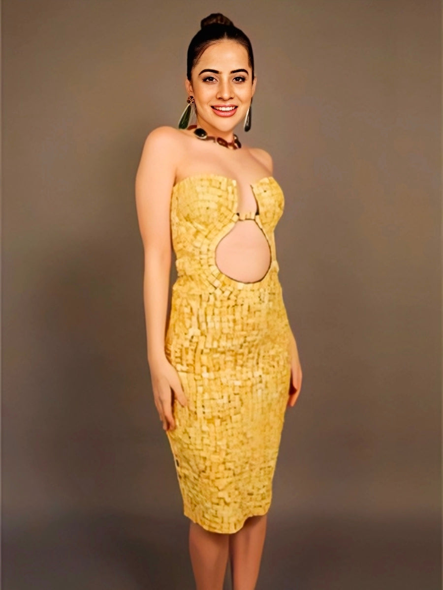 Urfi Javed yellow strapless dress made from cigarette butts with bold cutout eco couture fashion look