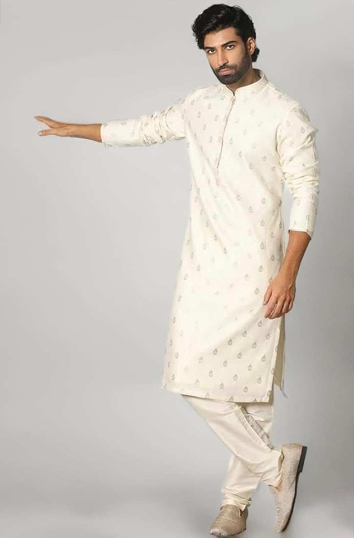 Engagement white dress for men featuring a classic white kurta with subtle woven motifs and churidar pants