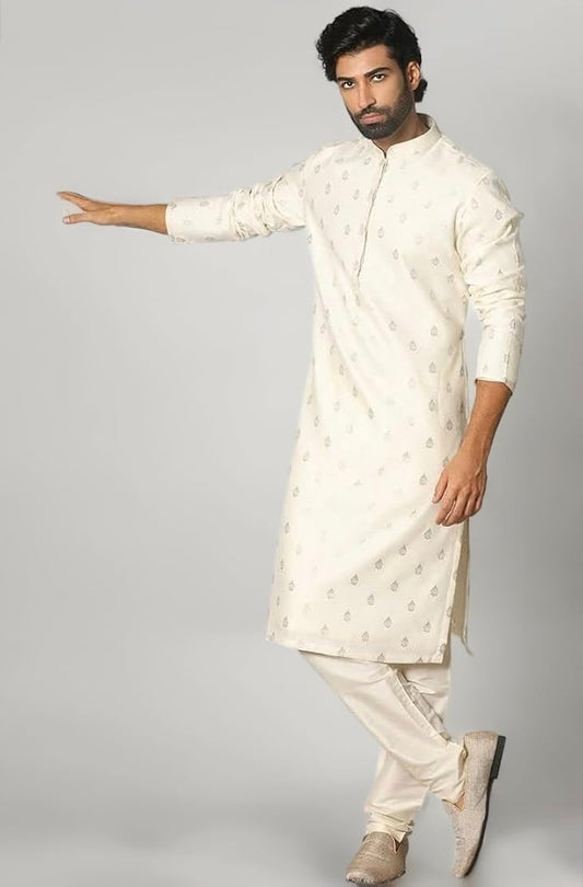 Engagement white dress for men featuring a classic white kurta with subtle woven motifs and churidar pants