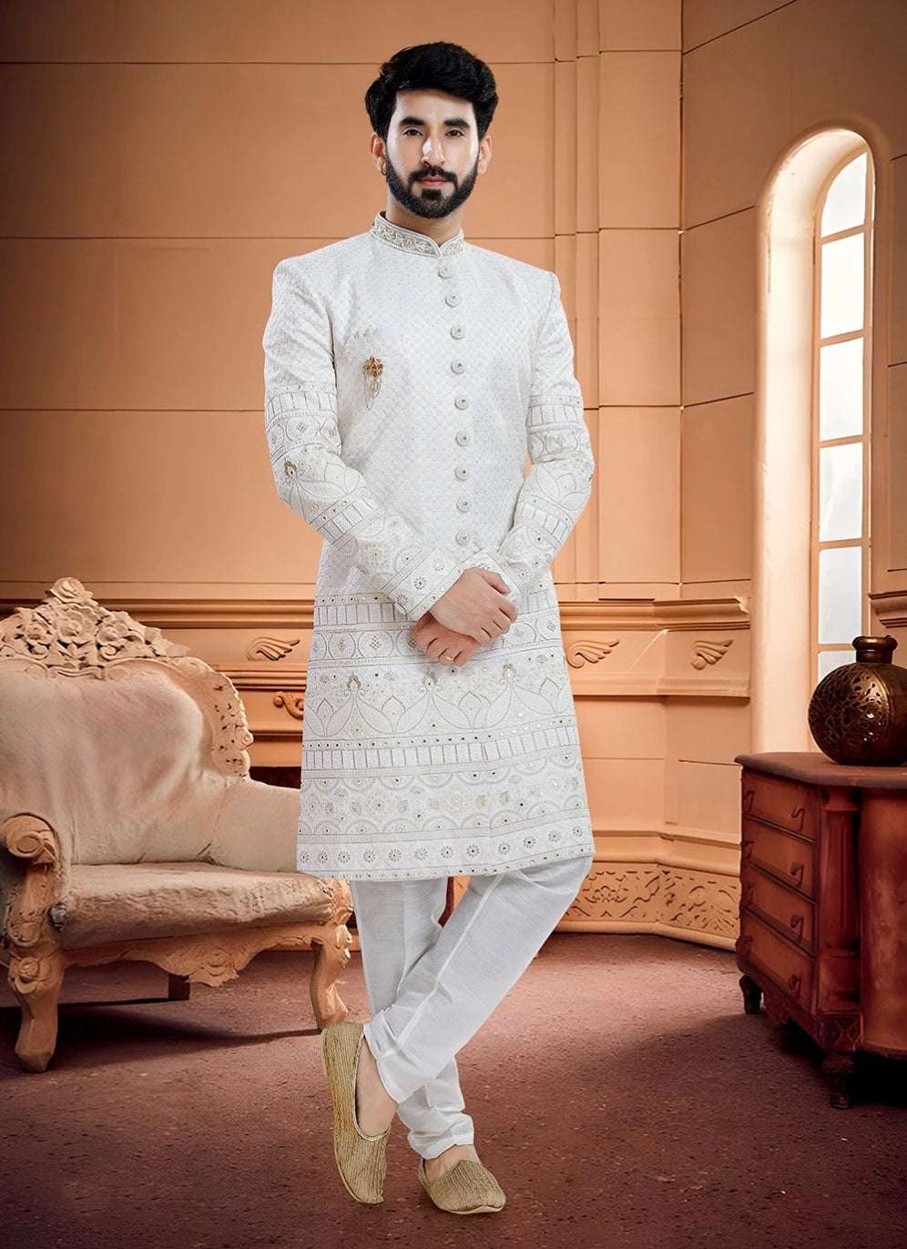 Engagement white dress for men featuring a heavily embroidered white kurta set for a royal groom look