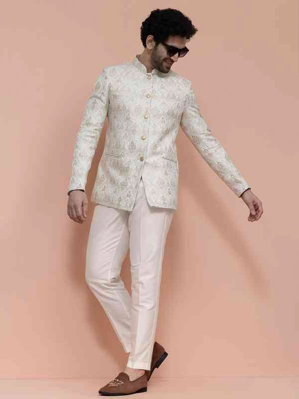 Ivory embroidered bandhgala set for men paired with tailored trousers for engagement and cocktail wear