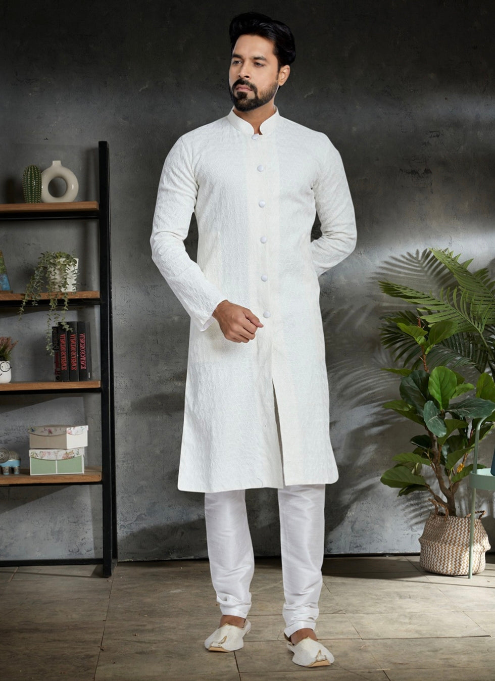 Engagement white dress for men featuring minimalist textured white kurta with churidar