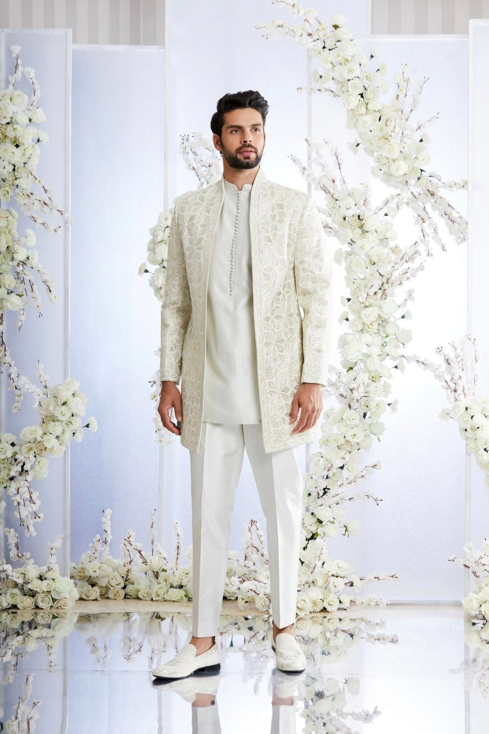 Engagement white dress for men featuring embroidered long jacket with kurta and trousers