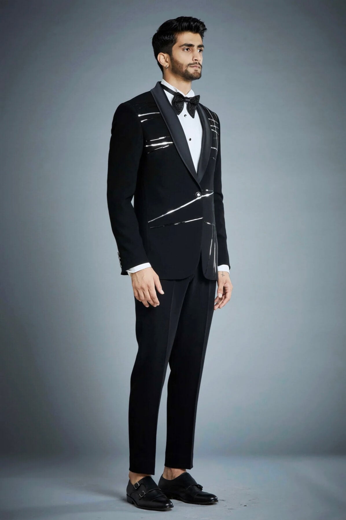 Black tuxedo suit for men with satin lapel and modern embellished design