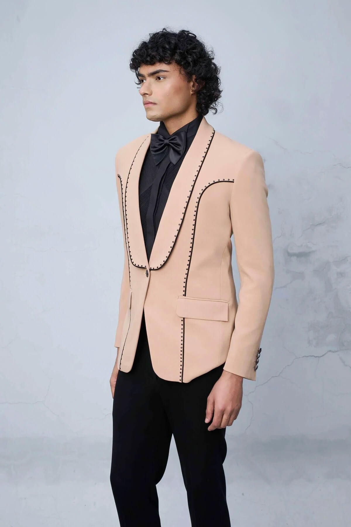 Peach Designer Tuxedo Suit for Men with Contrast Stitch Detailing & Black Lapel