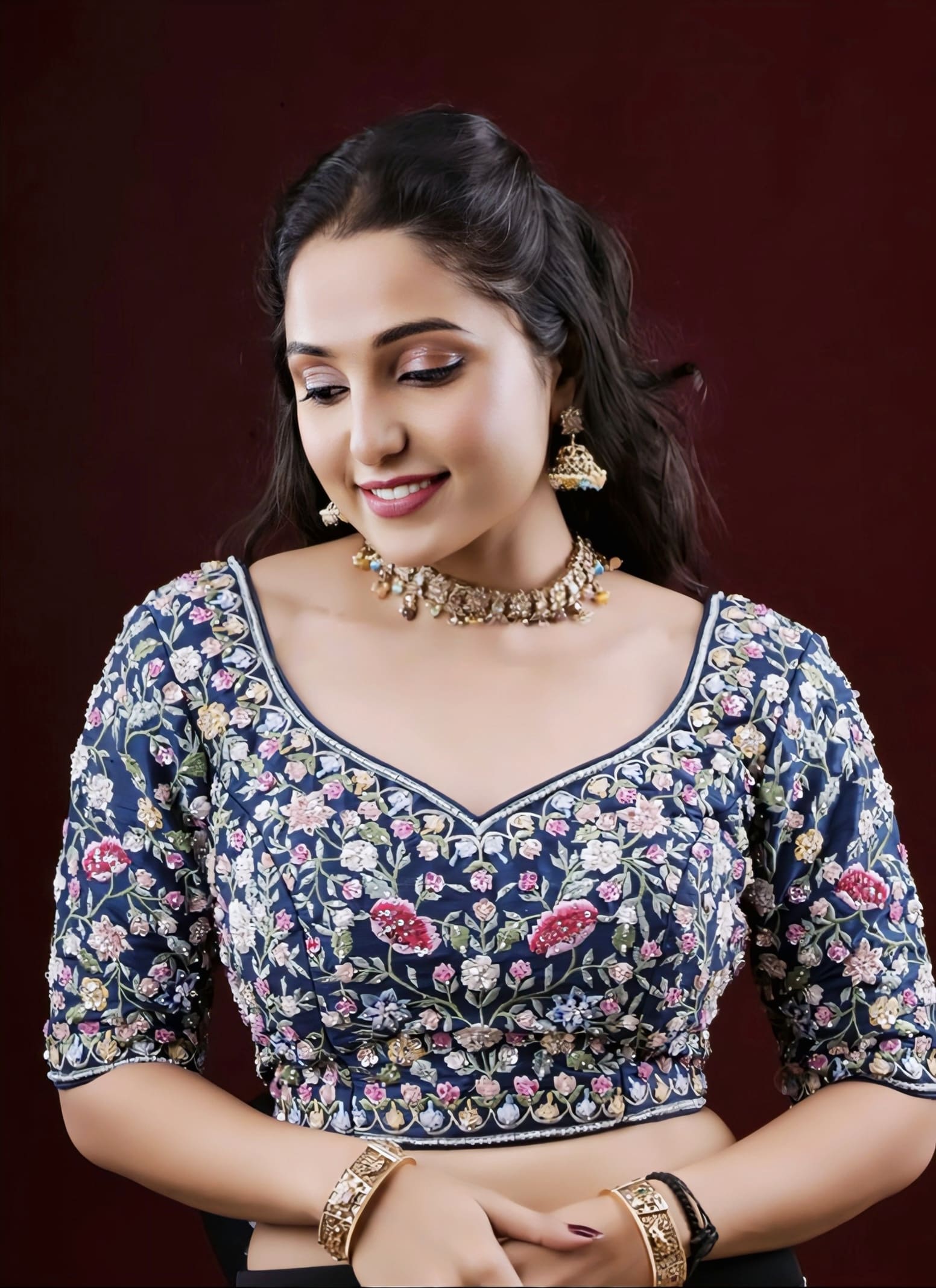 Navy blue princess cut blouse with multicolor floral embroidery and elbow length sleeves