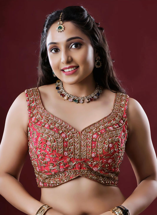 Red princess cut sleeveless blouse with heavy gold embroidery and V-neck design