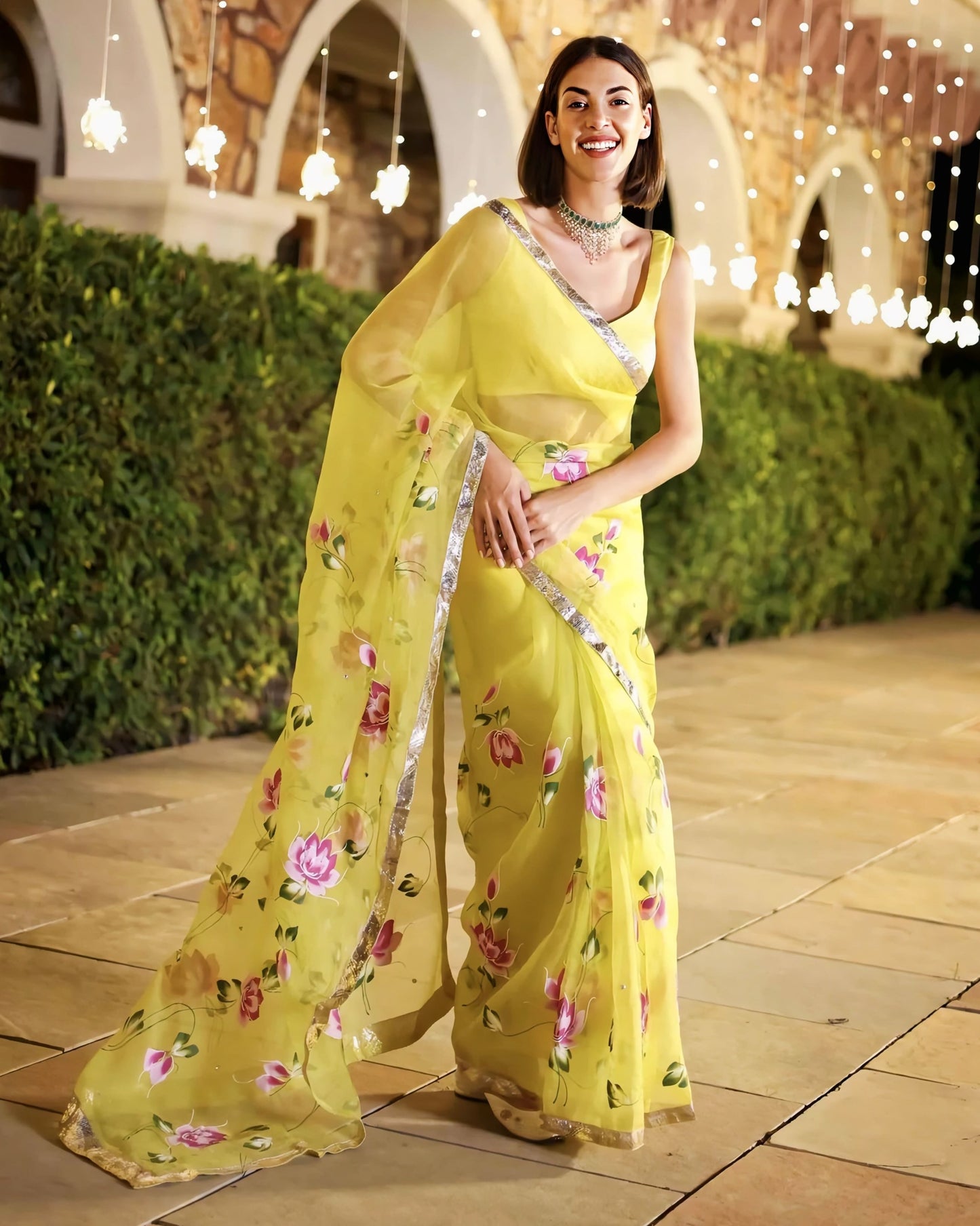 Yellow sheer saree with silver border and floral print