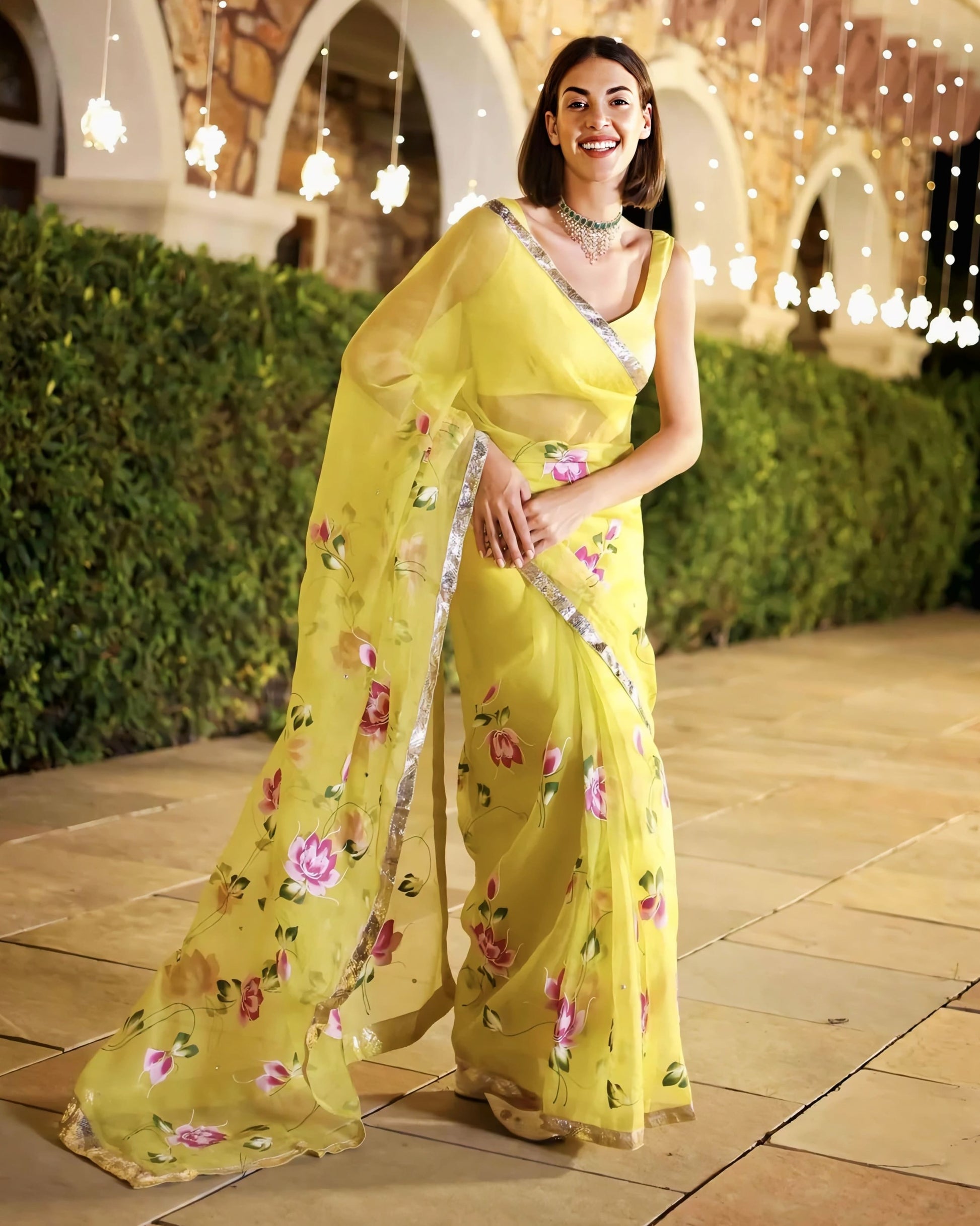 Yellow sheer saree with silver border and floral print