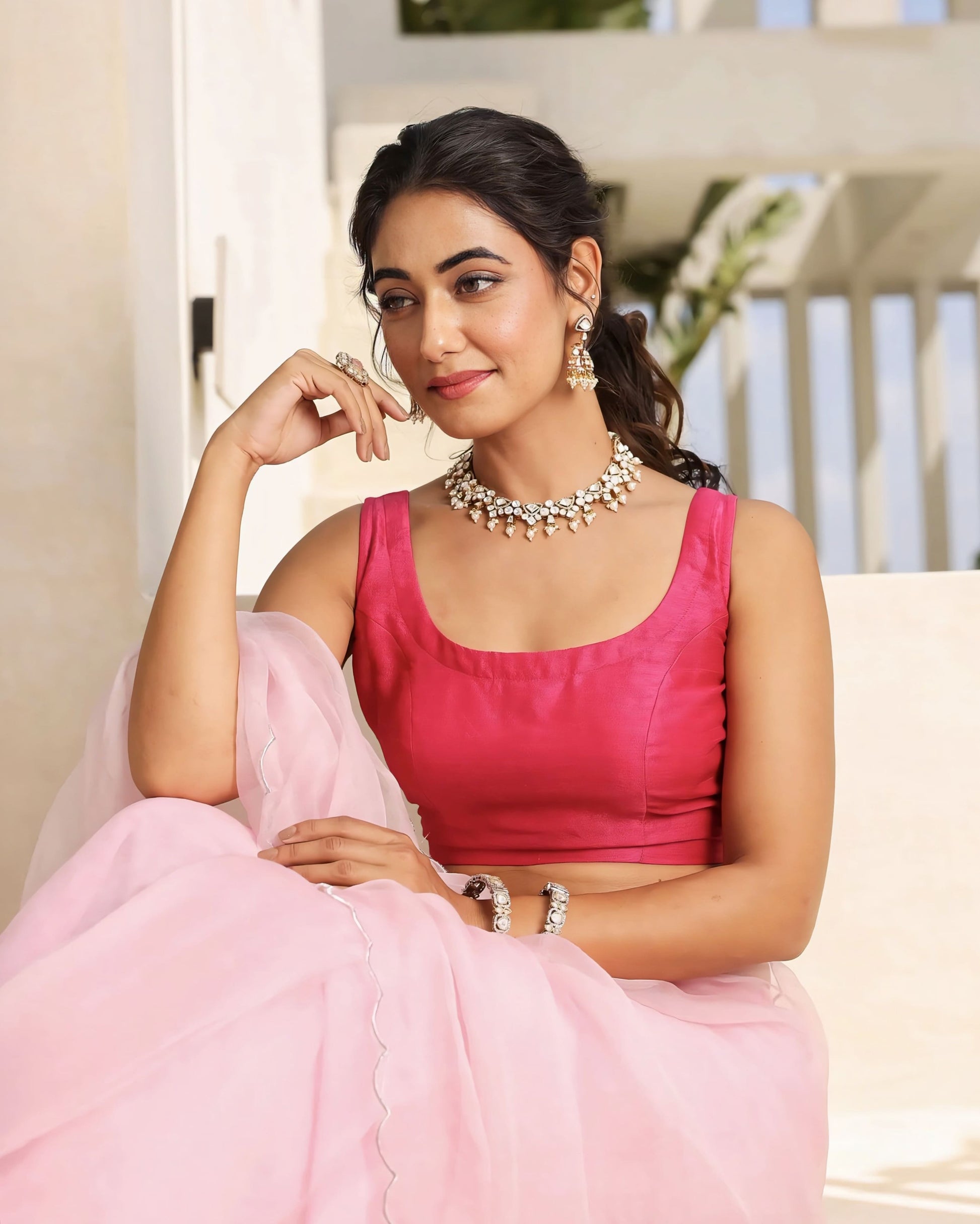 Blush pink sheer saree with solid sleeveless pink blouse