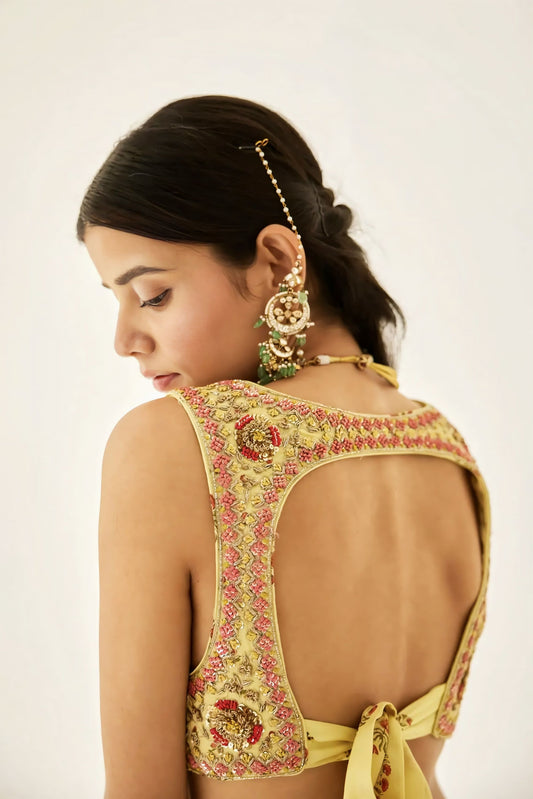 Yellow embroidered backless designer blouse with floral handwork and tie-up back