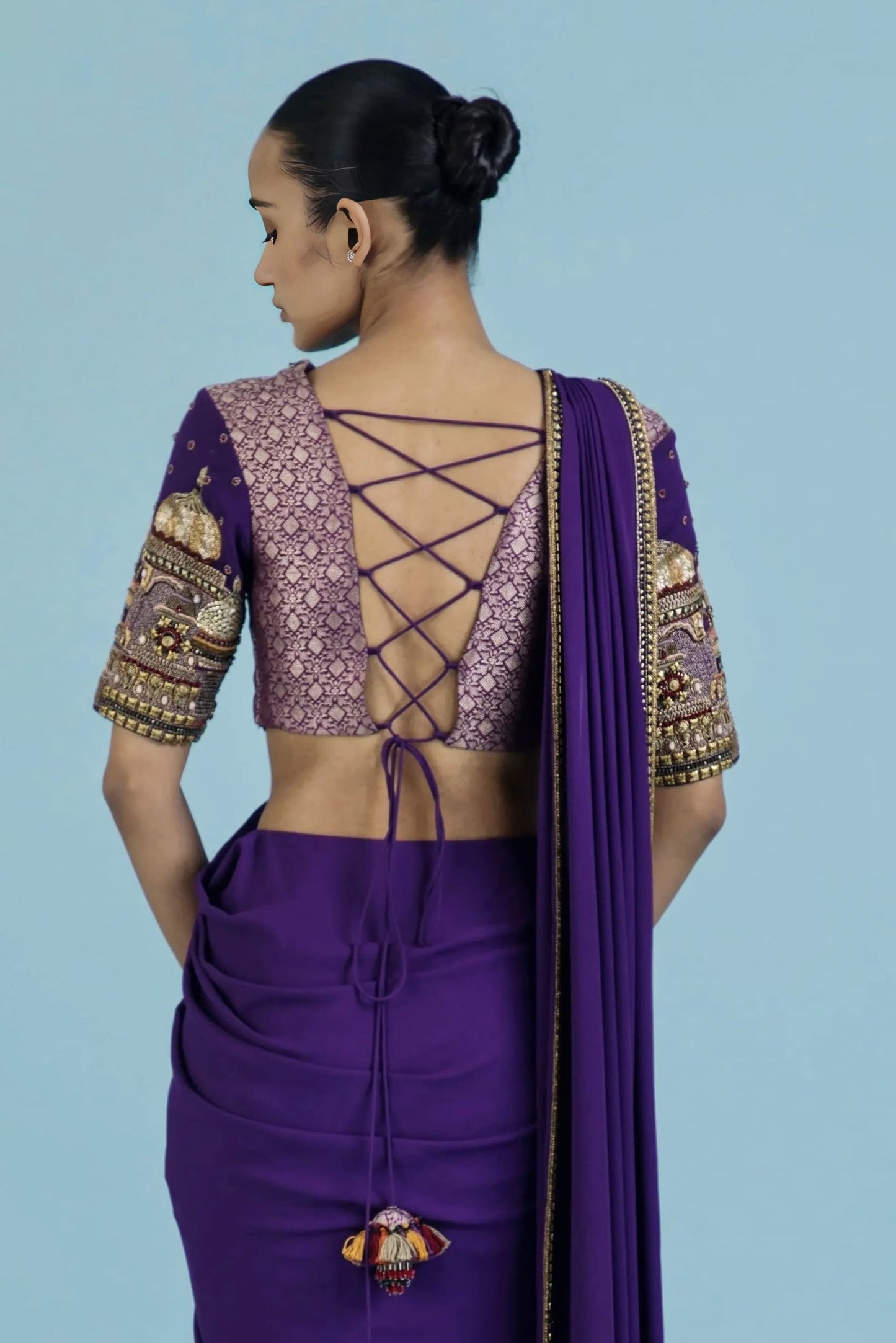 Royal purple princess cut blouse with criss cross tie up back and heavily embroidered elbow length sleeves