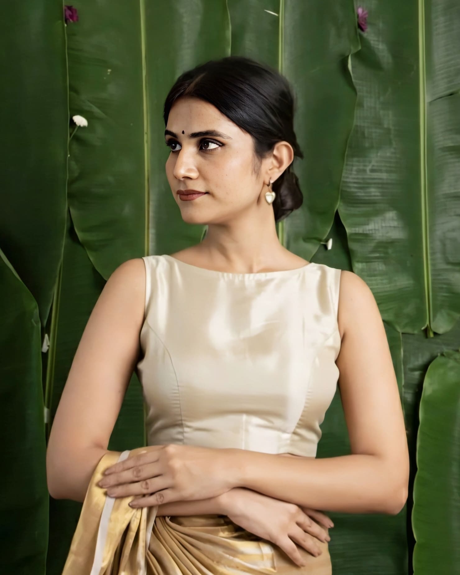 Champagne gold fancy blouse design with sleeveless high neck style for saree